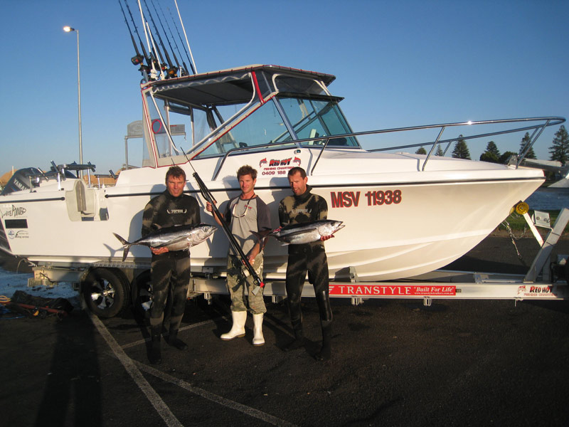 Rob-Torelli,-Simon-Rinaldi-and-Muray-Peterson-with-their-pioneering-catch-and-Simons-magnificent-charter-vessel..jpg